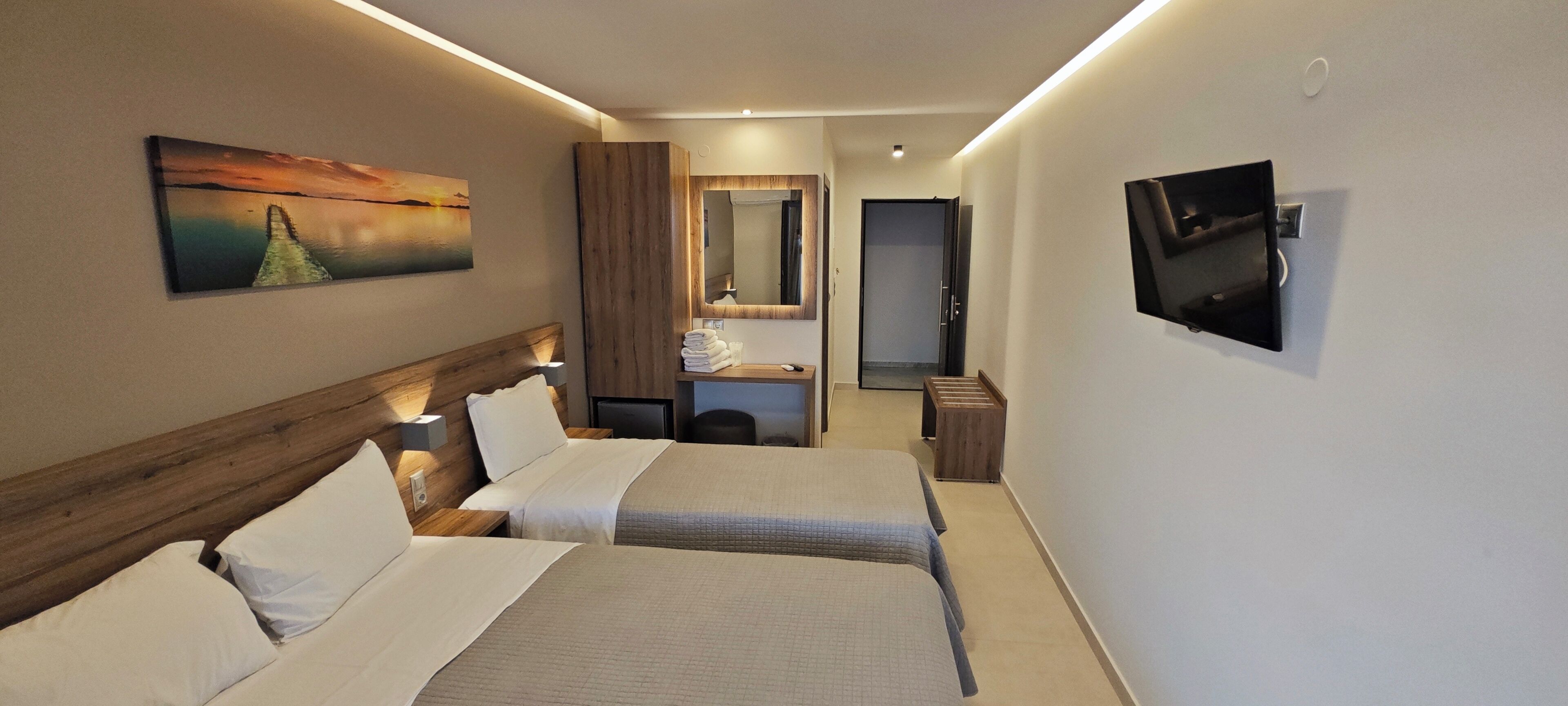 triple room, sea view | in-room safe, desk, soundproofing, iron/ironing board