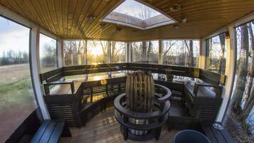 Relax in a serene outdoor space with a central fire feature and comfortable seating.