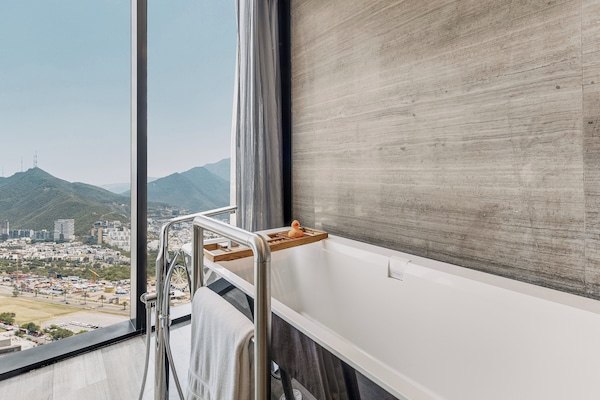 Egyptian cotton sheets, premium bedding, down duvets, minibar