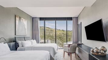 Premium bedding, down comforters, pillowtop beds, minibar