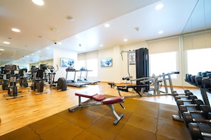 Work out in style with a fully equipped gym featuring treadmills, weight machines, and free weights.