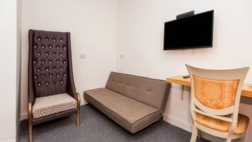 Deluxe Triple Room, 1 Double Bed with Sofa bed | Living area | 32-inch TV with cable channels