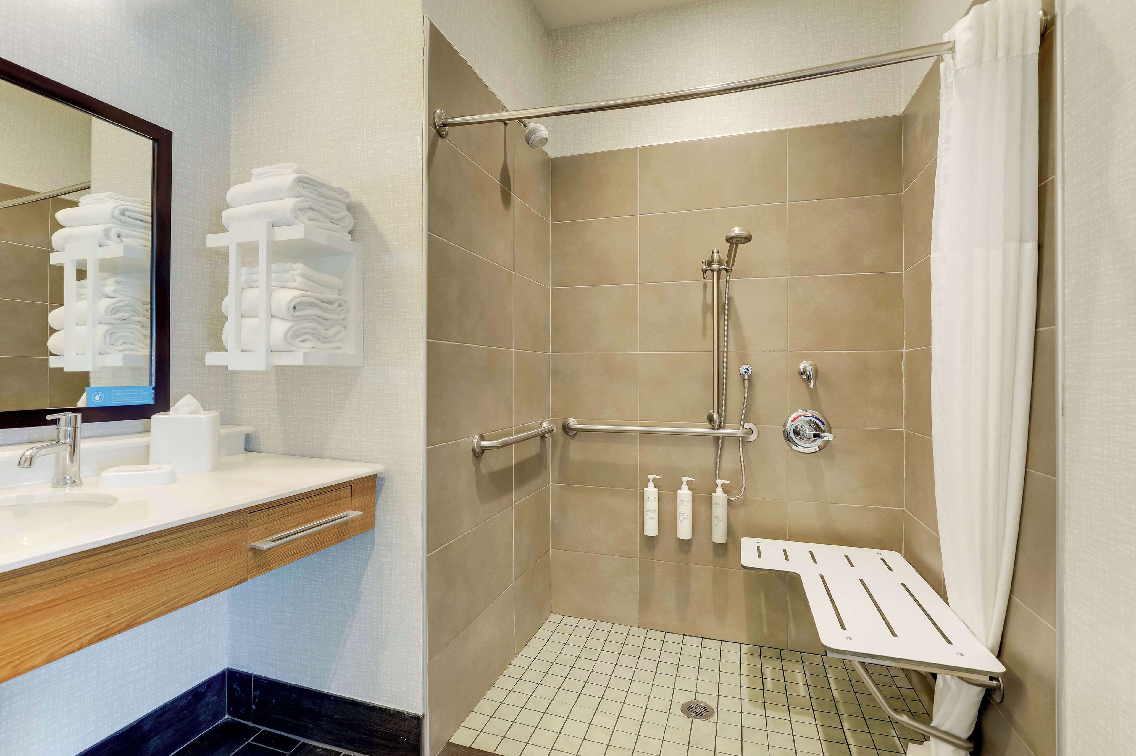 studio, 1 king bed, accessible (roll-in shower) | bathroom | combined shower/bathtub, free toiletries, towels