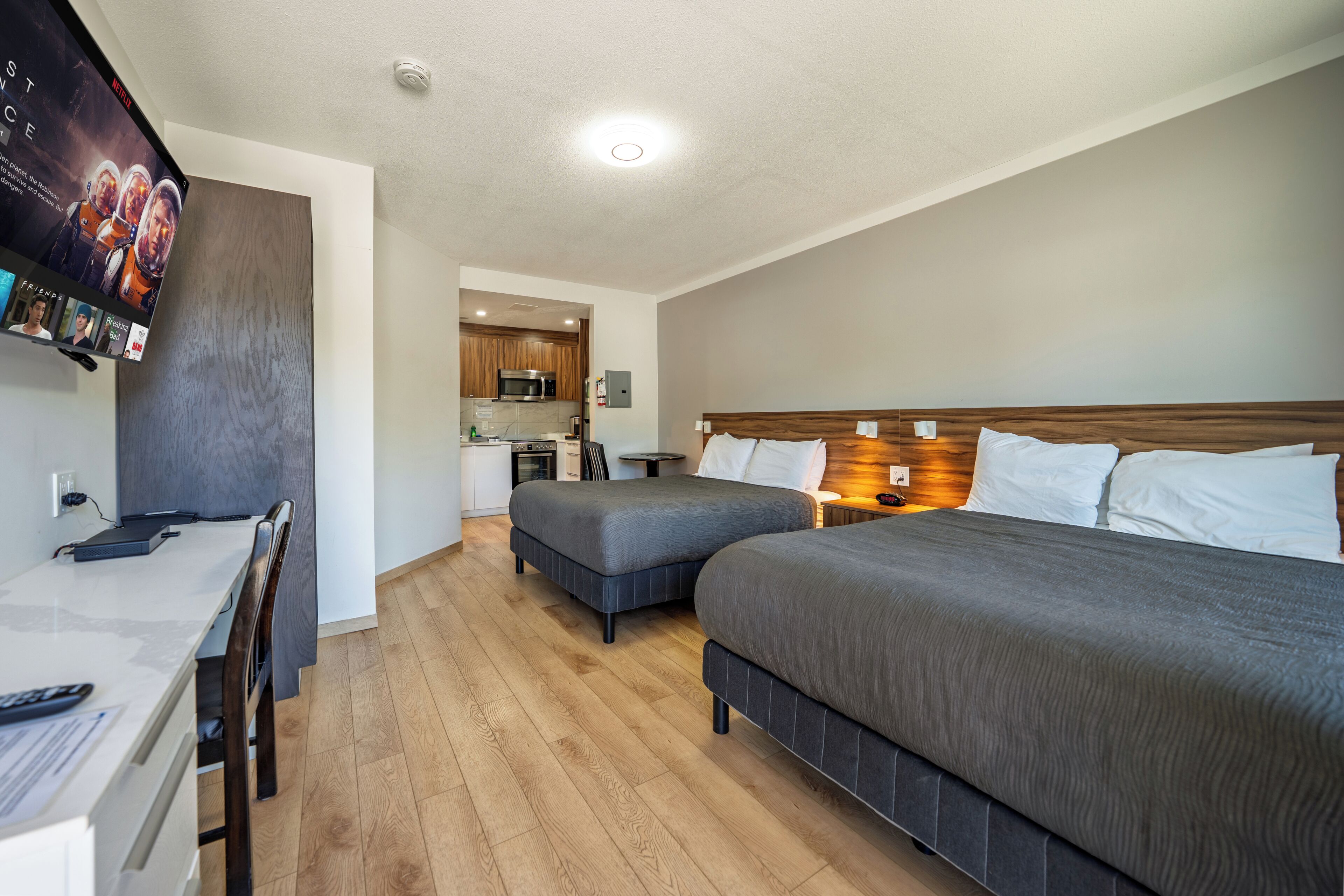 Deluxe Suite, 2 Queen Beds, Kitchen, Ground Floor | Private kitchen | Coffee/tea maker, full-sized fridge, microwave, electric kettle