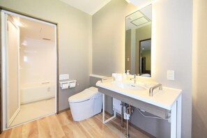 Combined shower/tub, free toiletries, hair dryer, slippers