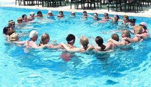 Guests can enjoy a refreshing swim in the pool surrounded by comfortable seating areas.