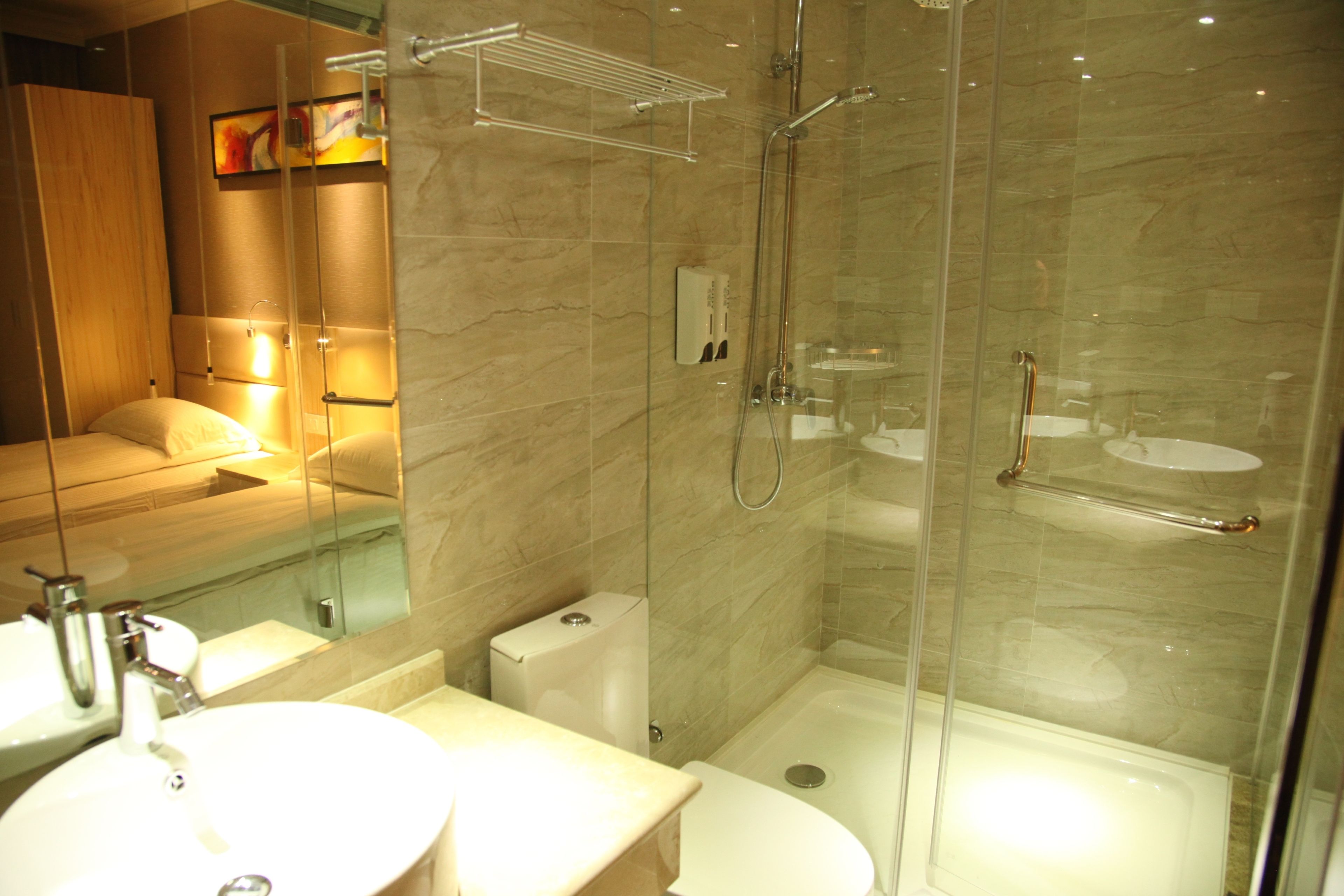 deluxe queen room | bathroom | shower, rainfall showerhead, free toiletries, hair dryer