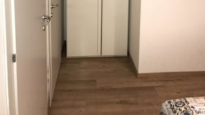 A room with a wardrobe, a door, and a wooden floor. - Elite Loreto Milano (Milan)