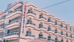 A multi-story hotel with a distinctive zigzag facade and balconies.