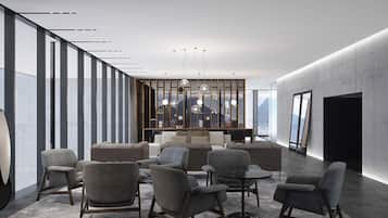 A modern interior with a seating area, a large window, and a view of the mountains.