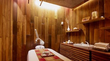 Cozy retreat with a comfortable bed, bedside table, and wooden bench.