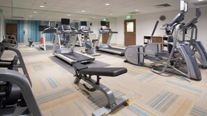 A gym with various exercise equipment including treadmills, elliptical machines, and weight benches. - Holiday Inn Express & Suites Alabaster by IHG (Alabaster)