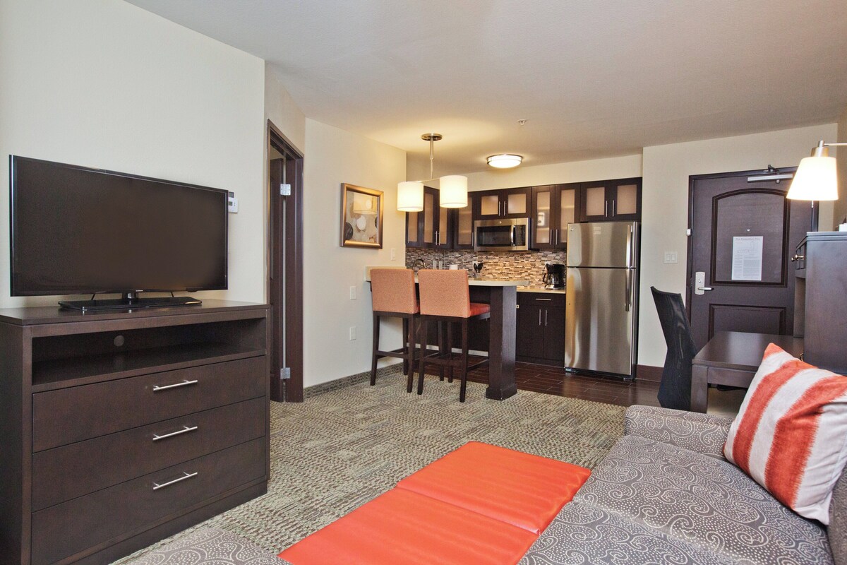 Desk, laptop workspace, blackout drapes, iron/ironing board