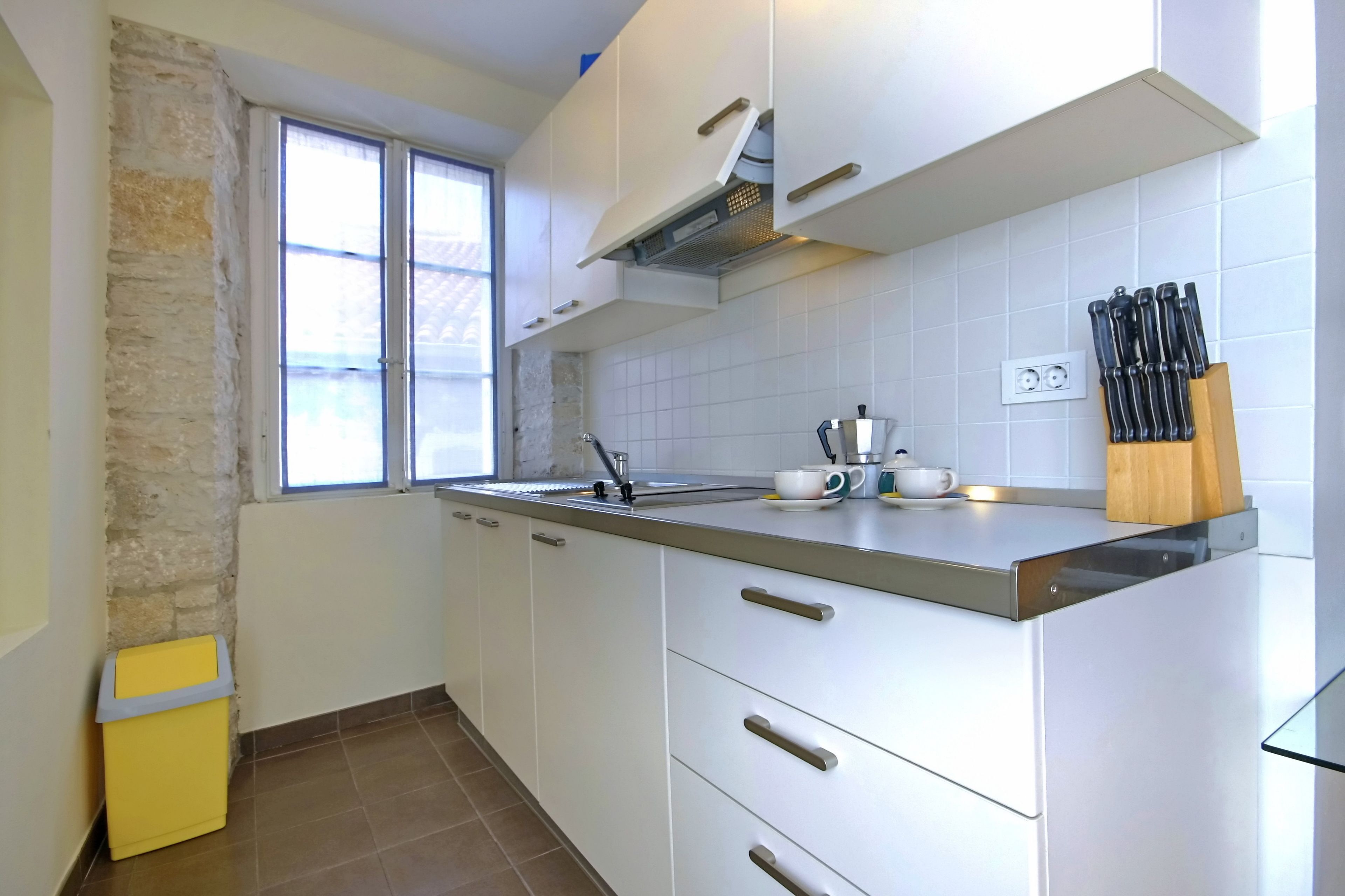 Full-sized fridge, espresso maker, cookware/dishes/utensils