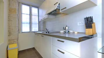 Full-sized fridge, espresso maker, cookware/dishes/utensils