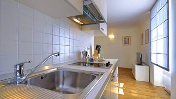 Full-sized fridge, espresso maker, cookware/dishes/utensils