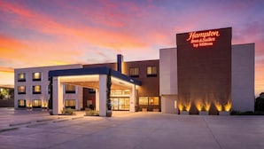 A Hampton Inn & Suites by Hilton building with a covered entrance and a prominent sign. - Hampton Inn & Suites by Hilton San Diego SeaWorld Near Old Town (San Diego)