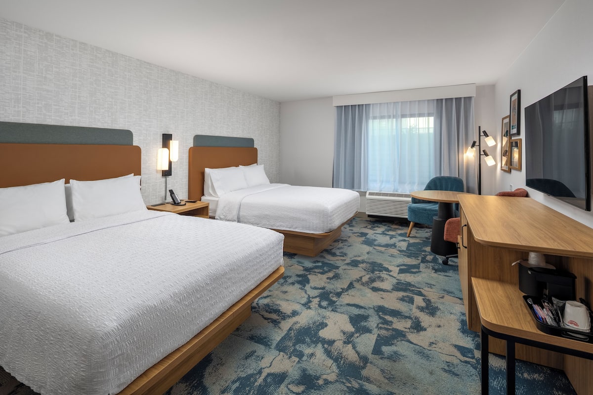 Premium bedding, Tempur-Pedic beds, desk, laptop workspace