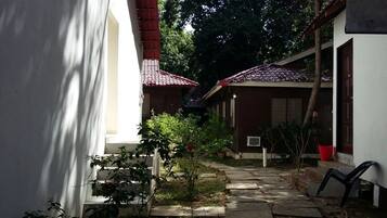 Stroll through the serene courtyard, surrounded by lush greenery and a tranquil atmosphere.