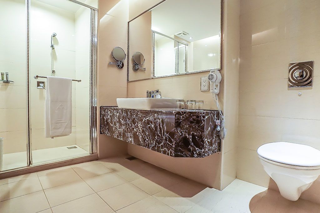 deluxe family room | bathroom | free toiletries, hair dryer, slippers, towels