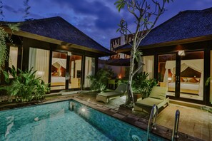 A modern hotel with a pool, outdoor seating, and a well-lit interior. - d’Nusa Beach Club and Resort (Lembongan Island)