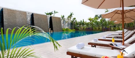 Outdoor pool, open 6:30 AM to 10 PM, pool loungers
