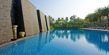Outdoor pool, open 6:30 AM to 10 PM, pool loungers