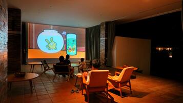 Guests can relax and enjoy animated content in this warm and inviting space.