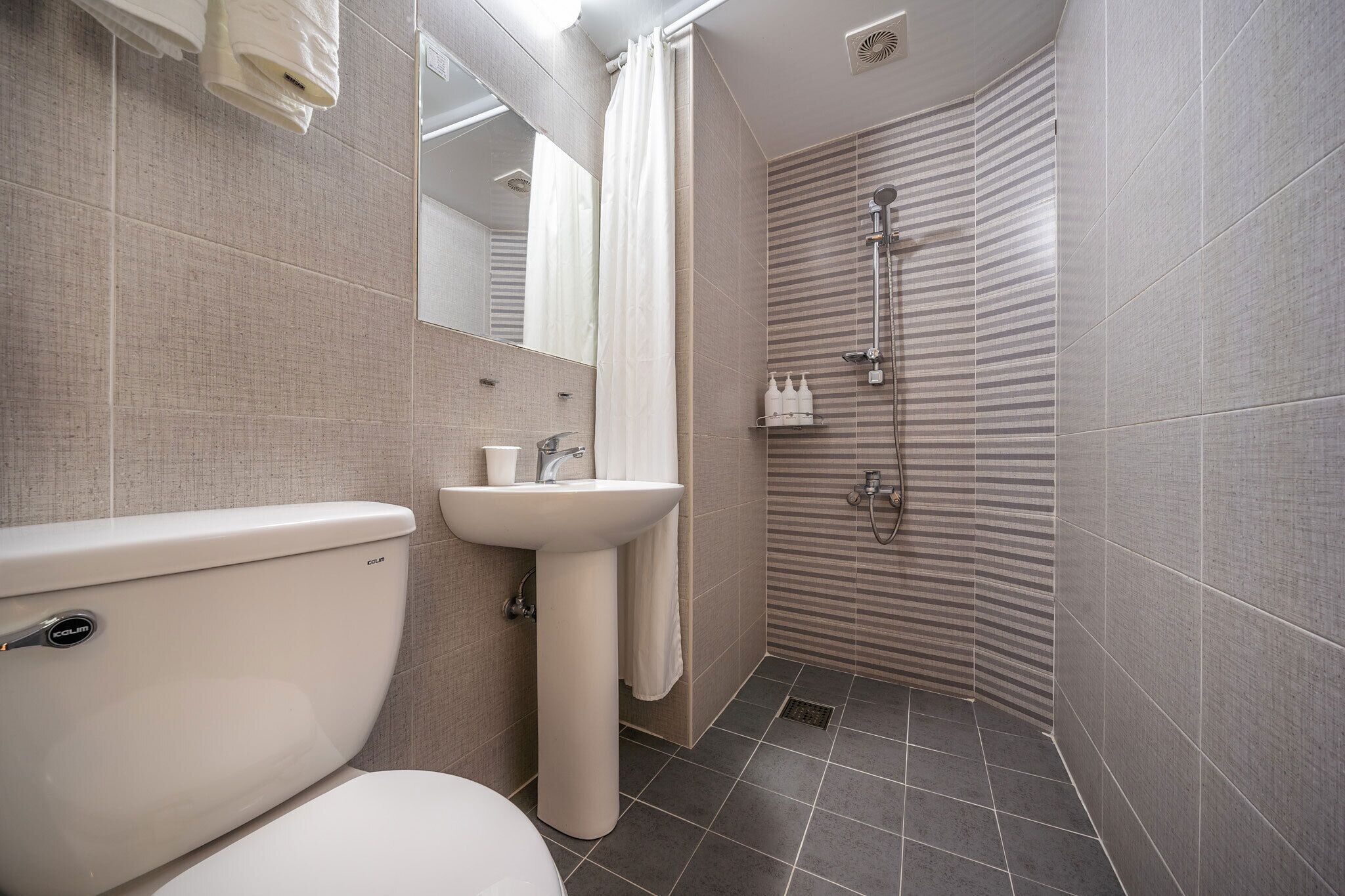 family twin room | bathroom | shower, hair dryer, towels, soap