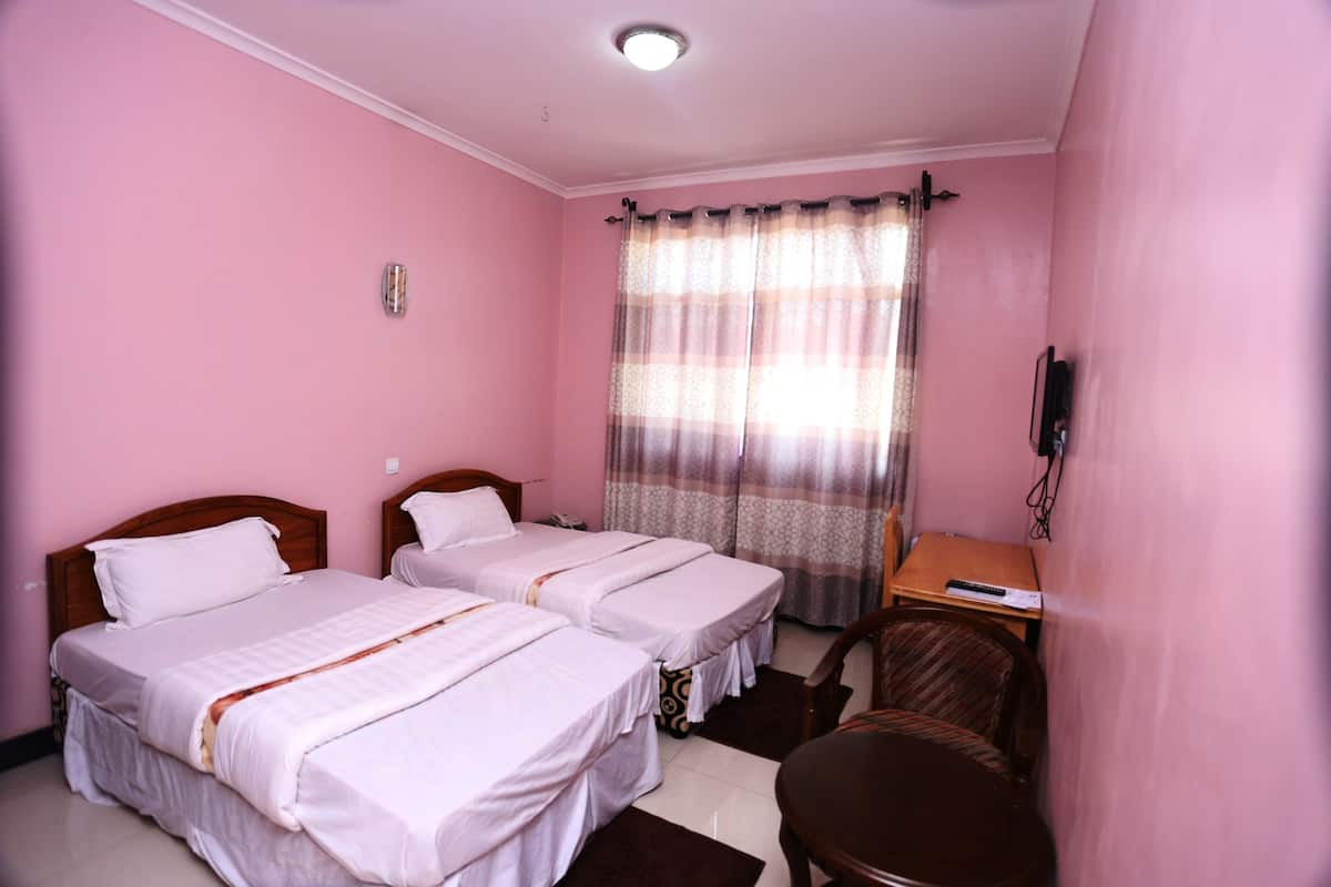 Twin Room | In-room safe, iron/ironing board, free cots/infant beds, rollaway beds