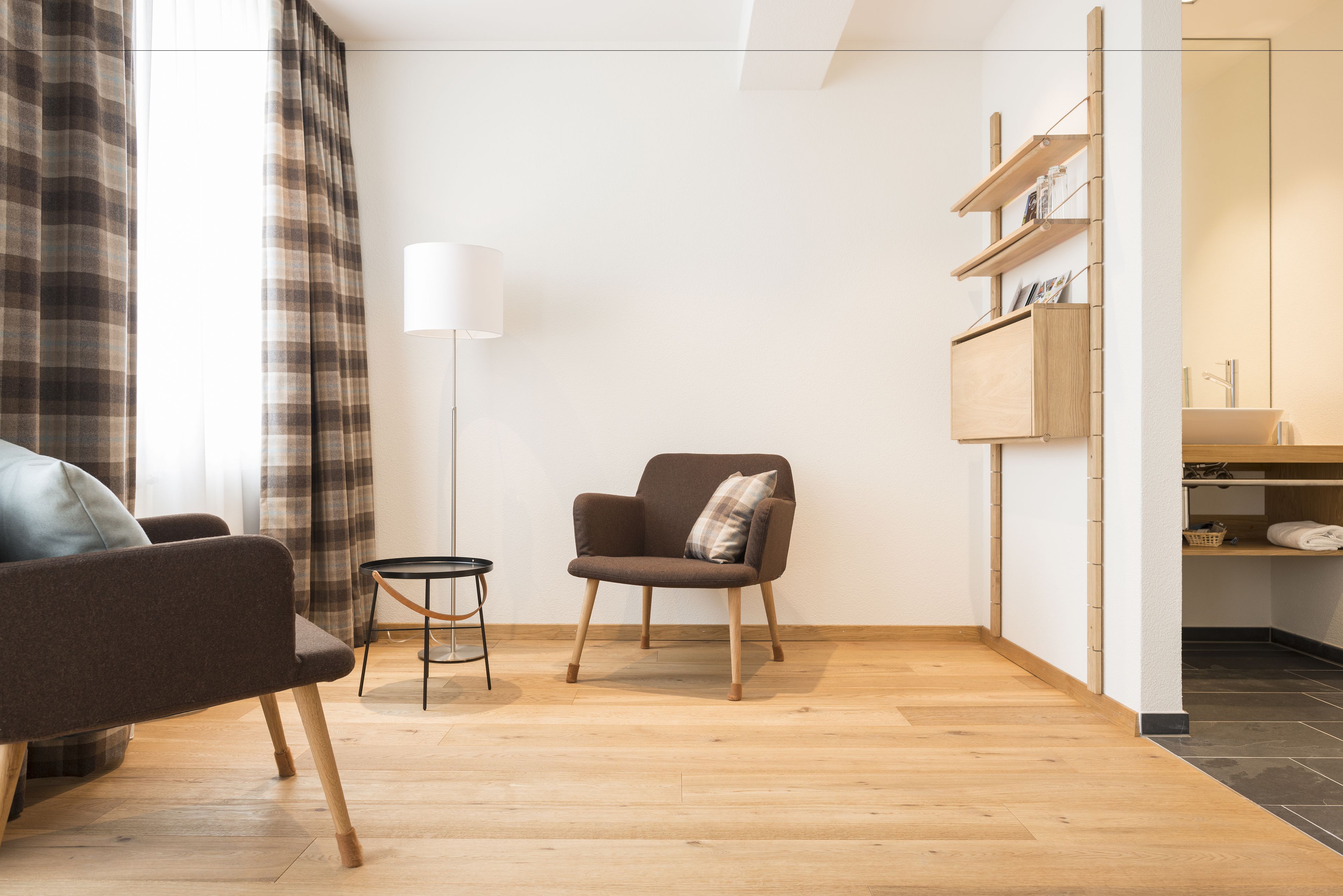 superior double room (alpenblick) | living area | 32-inch tv with satellite channels