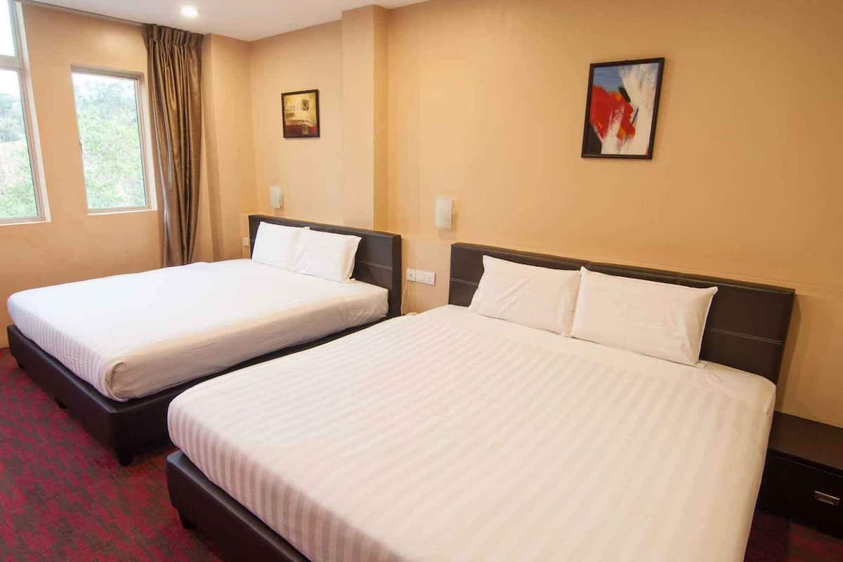A hotel room with two beds, a large window with curtains, and a painting on the wall.