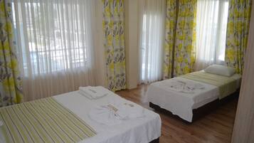Triple Room | Premium bedding, minibar, in-room safe, desk