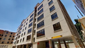 A multi-story building with a sign indicating a maximum height of 3.2m. - Fedha Residences (Nairobi)