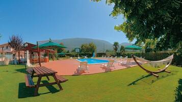 Outdoor pool, pool umbrellas, pool loungers