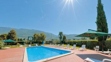 Outdoor pool, pool umbrellas, pool loungers