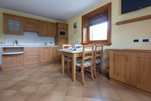 Apartment | Private kitchen | Full-size fridge, microwave, stovetop, dishwasher