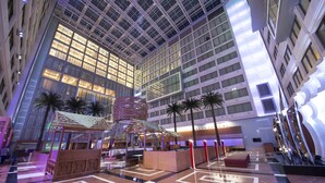 A spacious atrium with a high ceiling, large windows, and a checkered floor pattern. - Crowne Plaza Kuwait Al Thuraya City by IHG (Farwaniya)