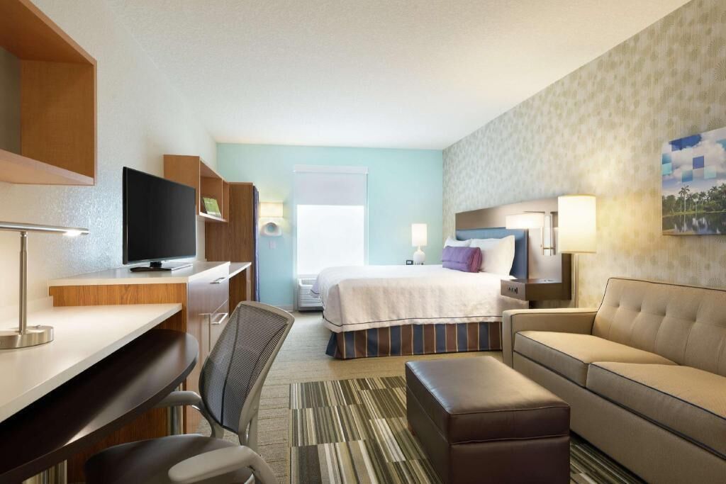 Premium bedding, desk, laptop workspace, blackout curtains