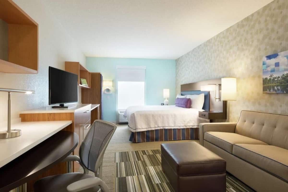 Premium bedding, desk, laptop workspace, blackout curtains