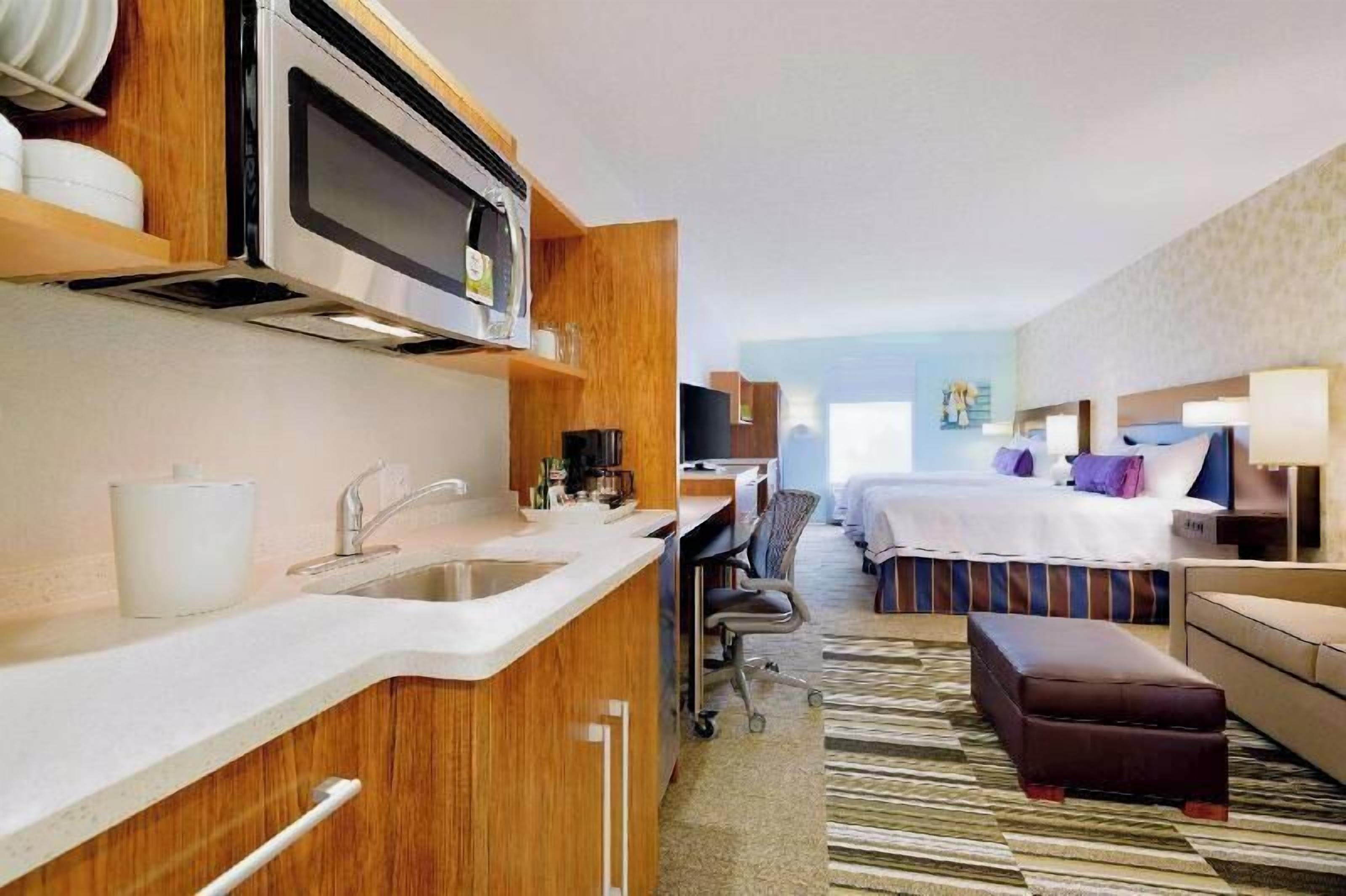 Premium bedding, desk, laptop workspace, blackout curtains