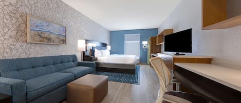 Premium bedding, desk, laptop workspace, blackout curtains