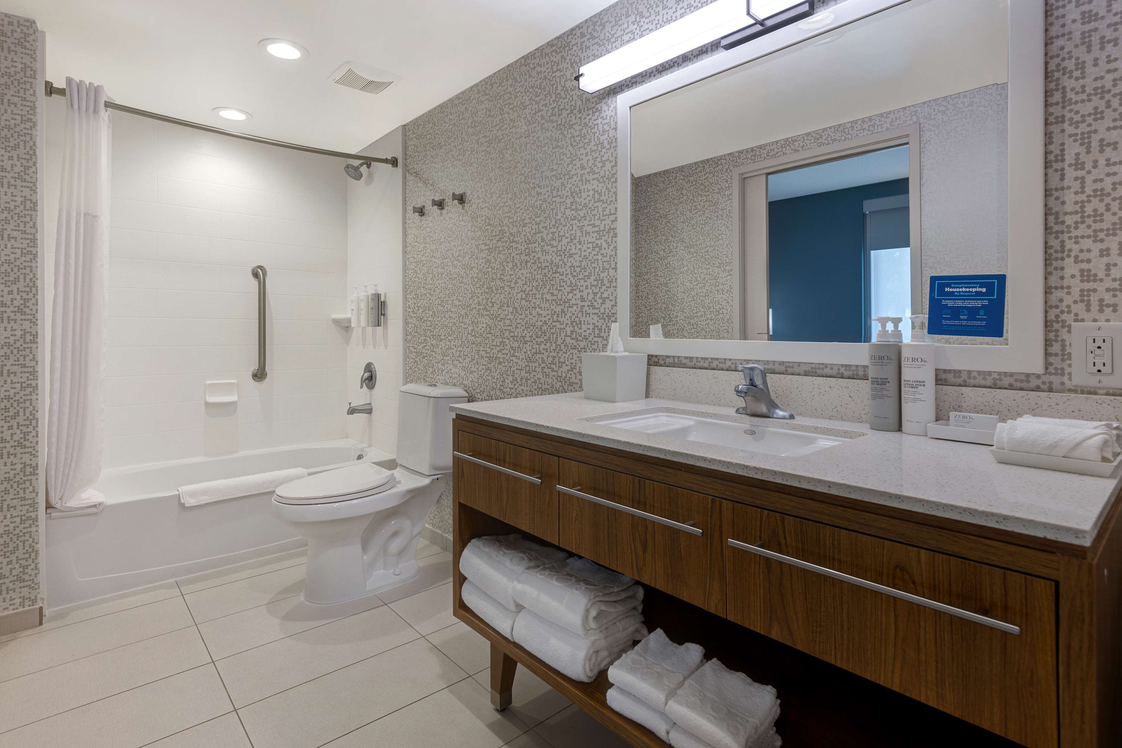 suite, 1 king bed, non smoking | bathroom | shower, free toiletries, towels