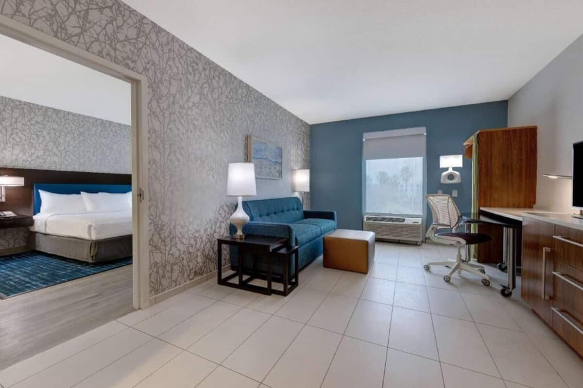 Premium bedding, desk, laptop workspace, blackout curtains