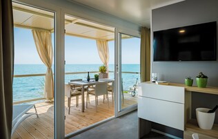 Amber Sea Luxury Village - Sea Holiday Home | Living area | 81-inch LCD TV with cable channels, TV, table tennis