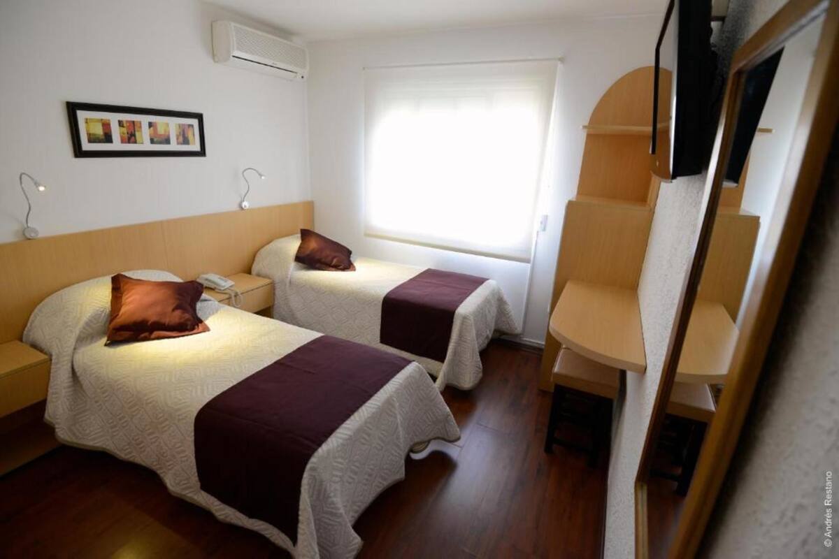 Triple Room | Minibar, blackout drapes, cribs (free), WiFi (free)