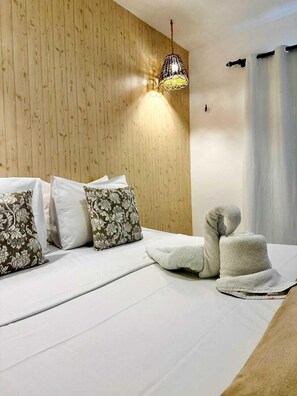 Suite Confort, vistas al jardín | 1 dormitorio, minibar, tabla de planchar con plancha y camas supletorias