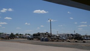 A parking lot with several RVs and cars. - Morning Star Inn (Anson)