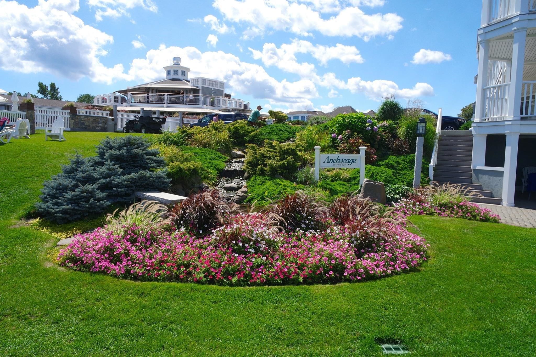 A landscaped garden with a sign reading "Archway."