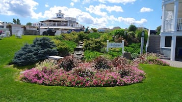 A landscaped garden with a sign reading "Archway."